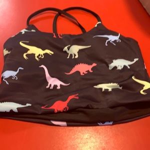 Black sports bra with colorful dinosaurs